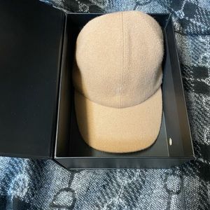 Quince cashmere camel baseball cap with fleece lining.